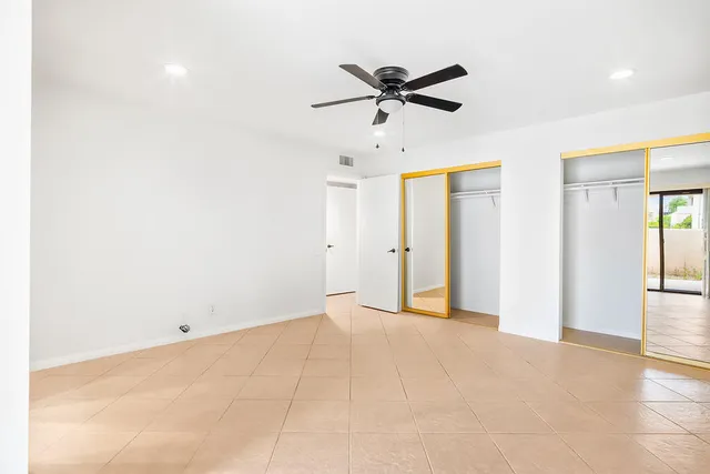 a bathroom with a sink a toilet and a large mirror