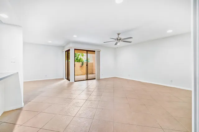 a view of kitchen appliances and cabinets