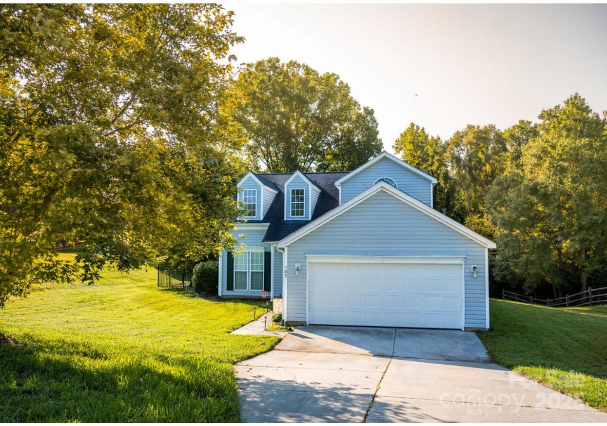 a front view of a house with yard