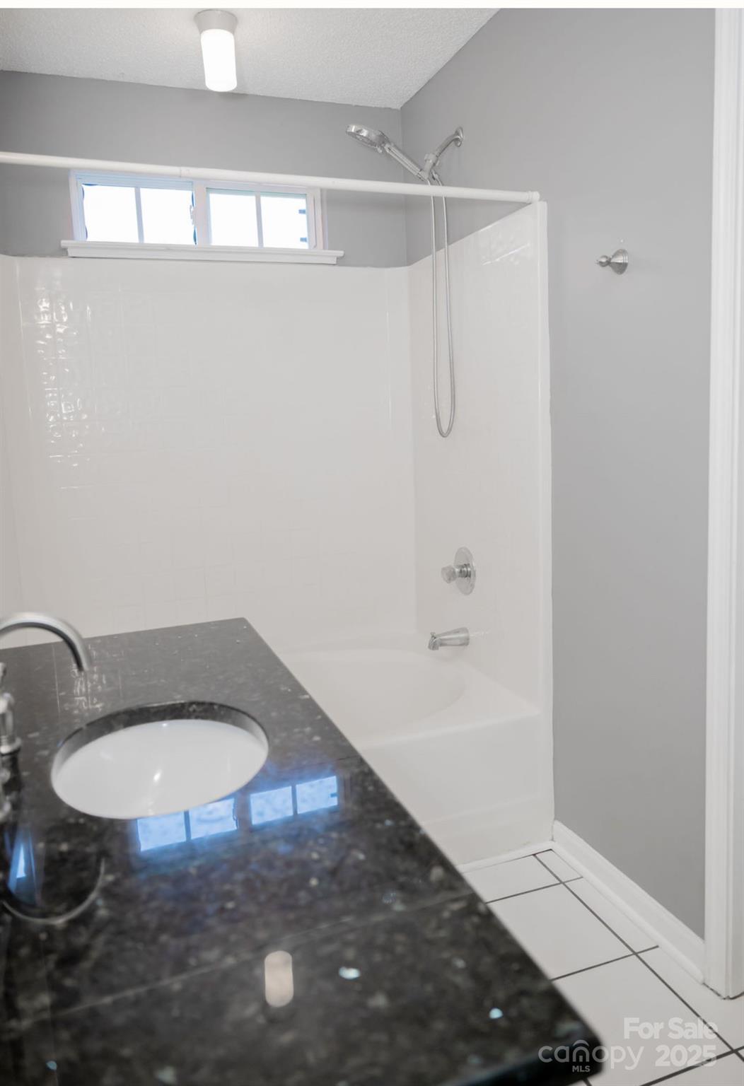 105 South Tanninger Road Mount Holly, NC 28120 - Photo 13 of 46 a bathroom with a sink and a toilet