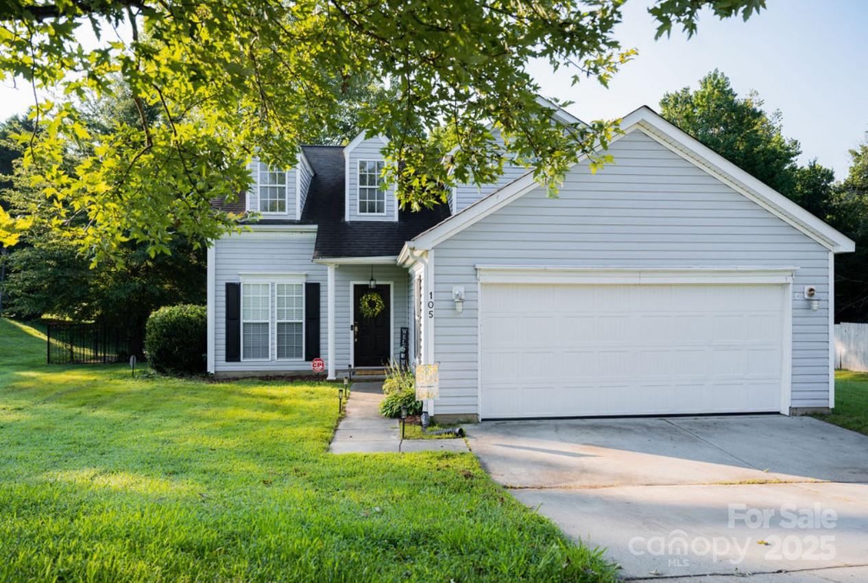105 South Tanninger Road Mount Holly, NC 28120 - Photo 2 of 46 a front view of house with yard and trees in the background