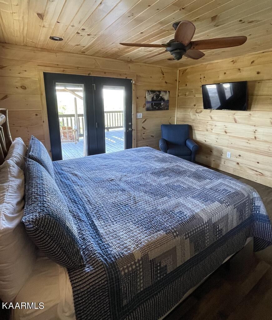 2252 Coopers Hawk Way Sevierville, TN 37862 - Photo 23 of 56 a bedroom with a bed next to a window