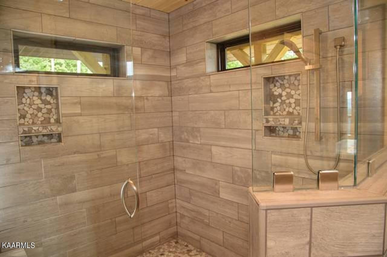 2252 Coopers Hawk Way Sevierville, TN 37862 - Photo 25 of 56 a bathroom with a sink a toilet and shower