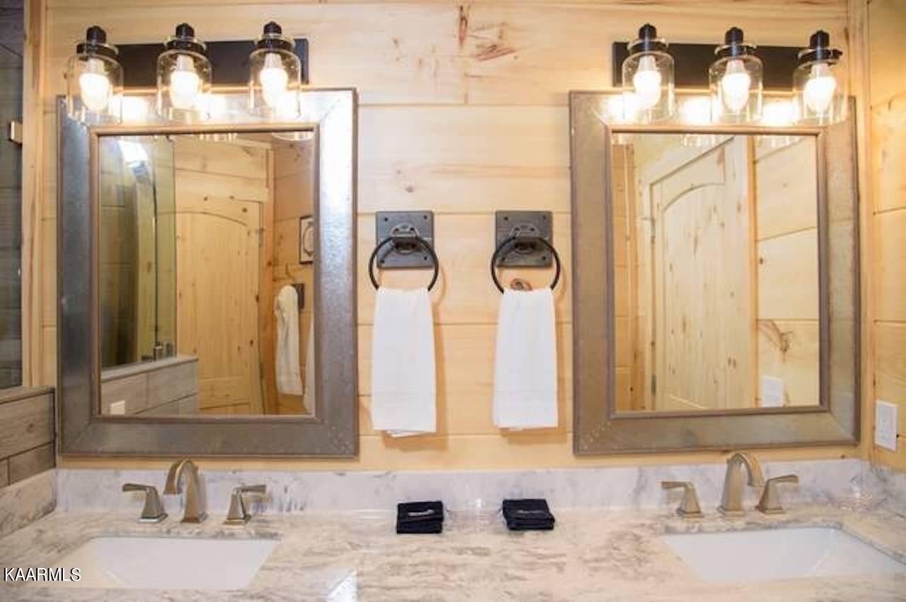 2252 Coopers Hawk Way Sevierville, TN 37862 - Photo 26 of 56 a bathroom with a sink and mirror