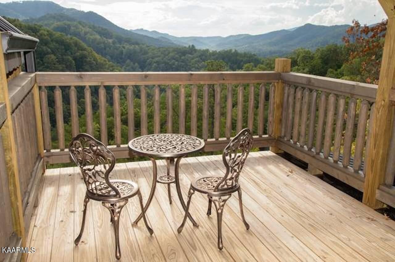 2252 Coopers Hawk Way Sevierville, TN 37862 - Photo 35 of 56 a view of a chairs and table on the deck