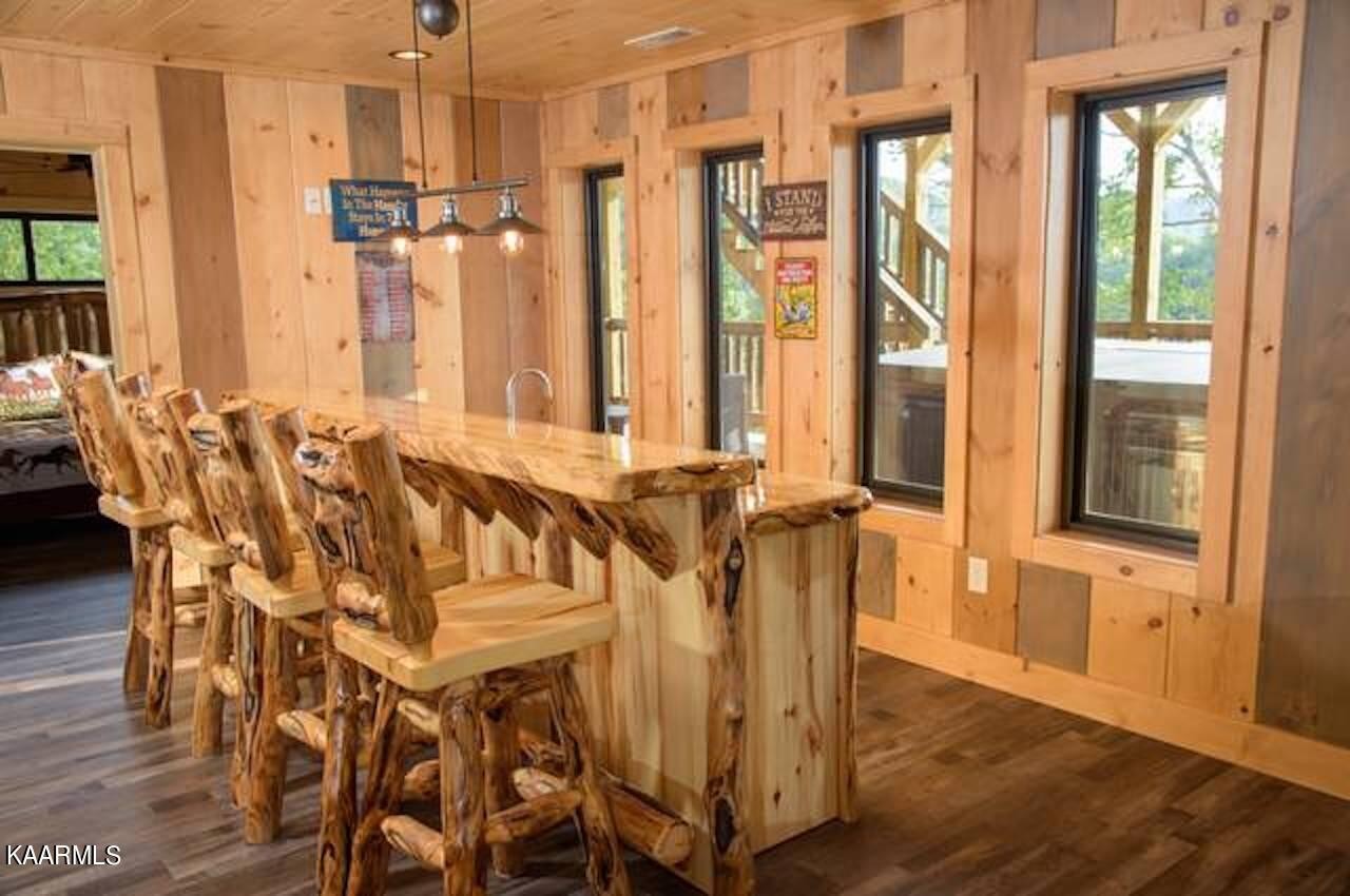 2252 Coopers Hawk Way Sevierville, TN 37862 - Photo 41 of 56 a view of a dining room with furniture and wooden floor