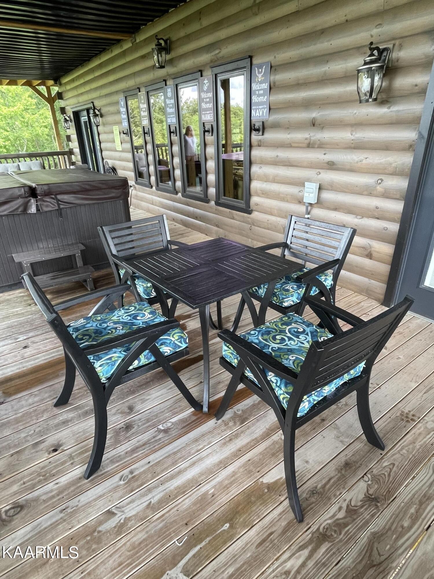 2252 Coopers Hawk Way Sevierville, TN 37862 - Photo 48 of 56 a wooden bench sitting in front of a building