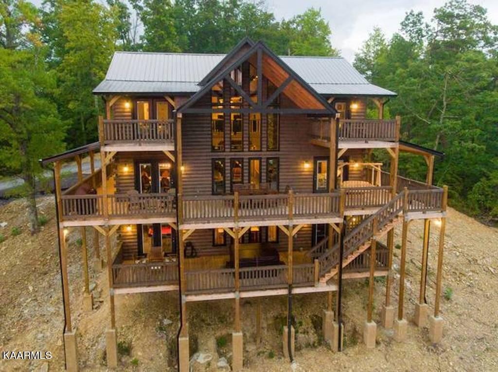2252 Coopers Hawk Way Sevierville, TN 37862 - Photo 8 of 56 a front view of a house with balcony