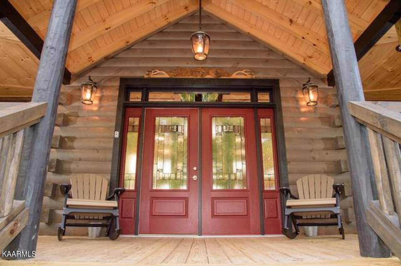 2252 Coopers Hawk Way Sevierville, TN 37862 - Photo 10 of 56 a view of front door of house with outdoor seating