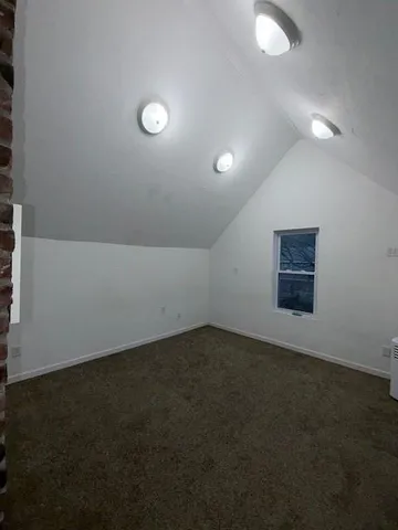 an empty room with a empty space and window