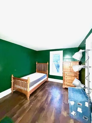 a view of a porch with furniture and a yard