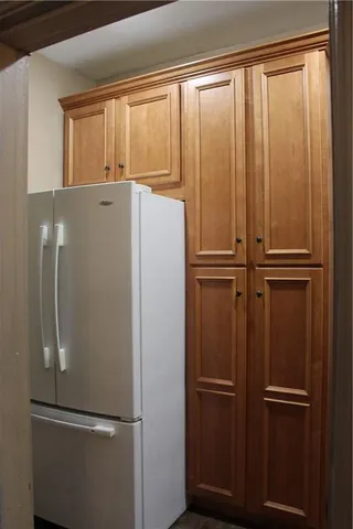 a white refrigerator freezer and a dishwasher in a kitchen