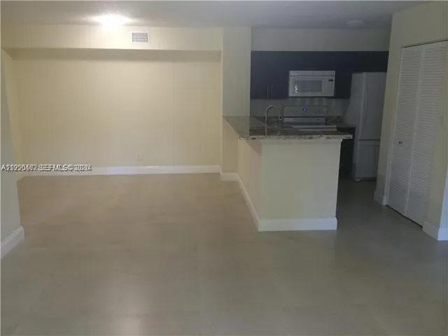 a view of a microwave and a sink