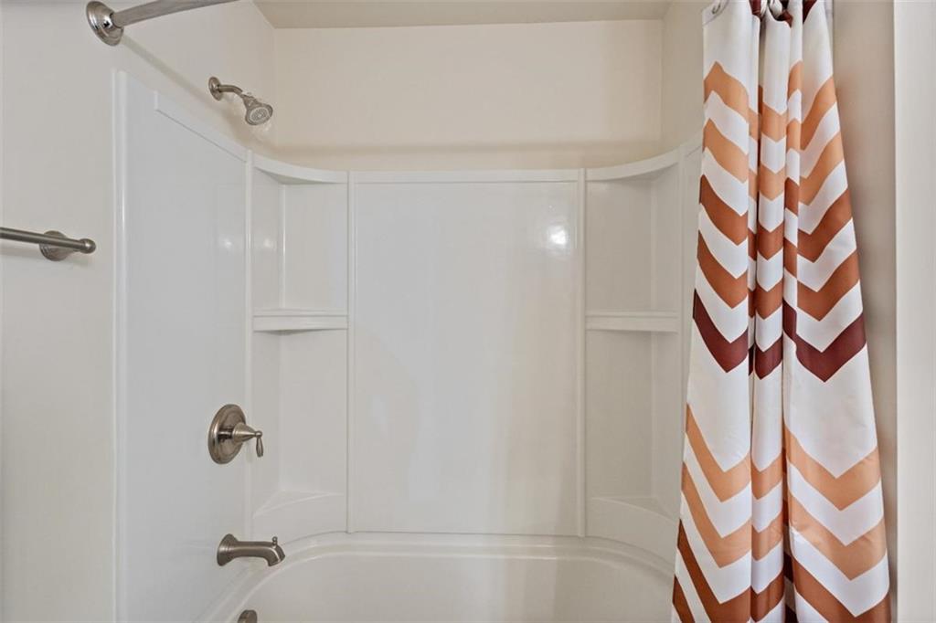 3500 Graham Way Southwest Lilburn, GA 30047 - Photo 24 of 47 a bathroom with a shower curtain