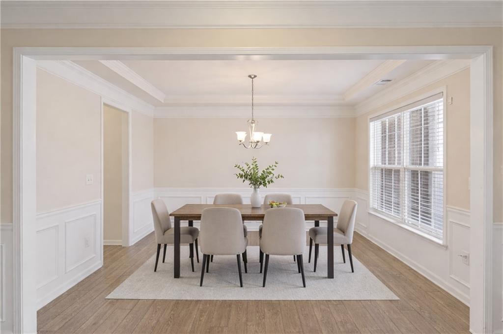 3500 Graham Way Southwest Lilburn, GA 30047 - Photo 7 of 47 a view of a dining room with furniture window and wooden floor