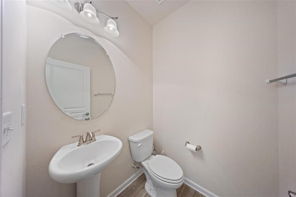 3500 Graham Way Southwest Lilburn, GA 30047 - Photo 8 of 47 a bathroom with a toilet a sink and mirror