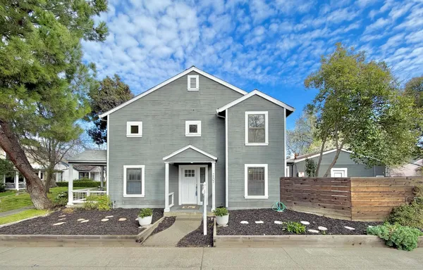 a front view of a house with a yard
