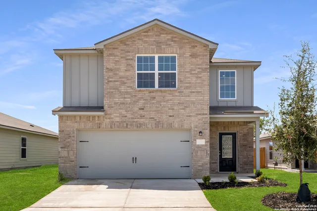 a view of house with yard