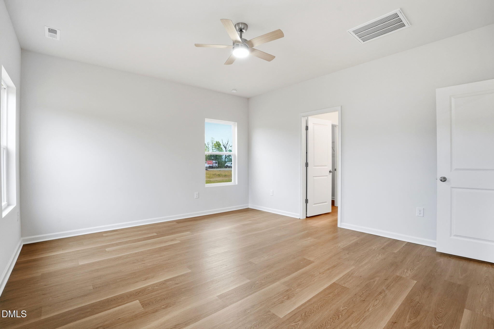 9019 Phoenix Court Spring Hope, NC 27882 - Photo 24 of 34 an empty room with a window and a ceiling fan