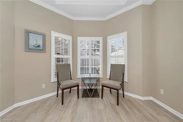 a view of a livingroom with furniture and a window