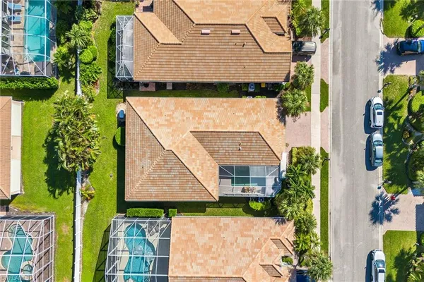 an aerial view of residential houses and outdoor space