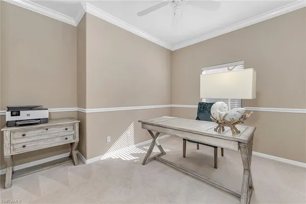 a view of a workspace with furniture