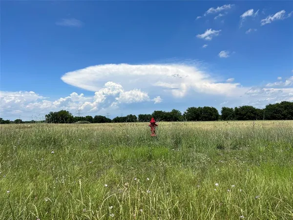 a view of lake with mountain in the background