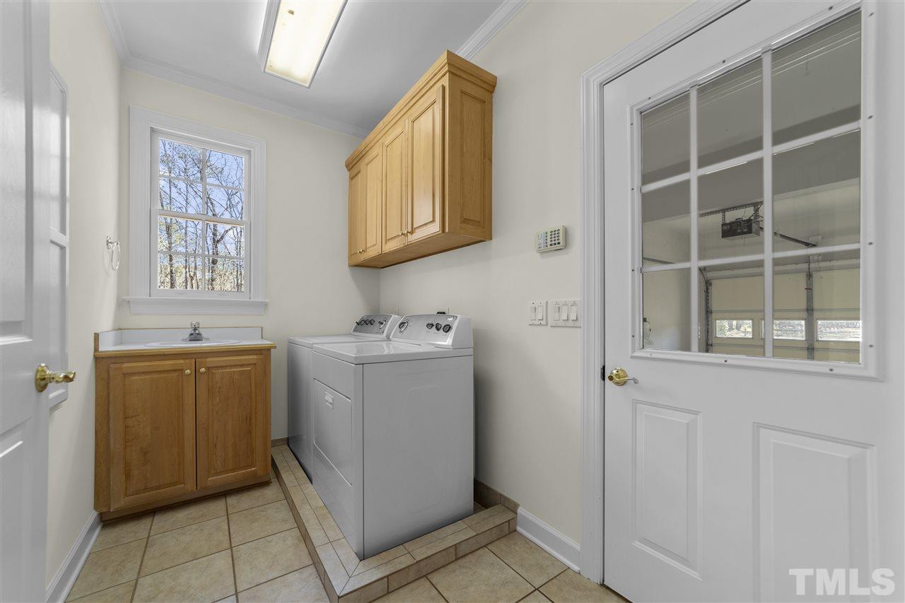 6521 Brack Penny Road Raleigh, NC 27603 - Photo 16 of 30 1st Floor Laundry Room with Laundry Sink