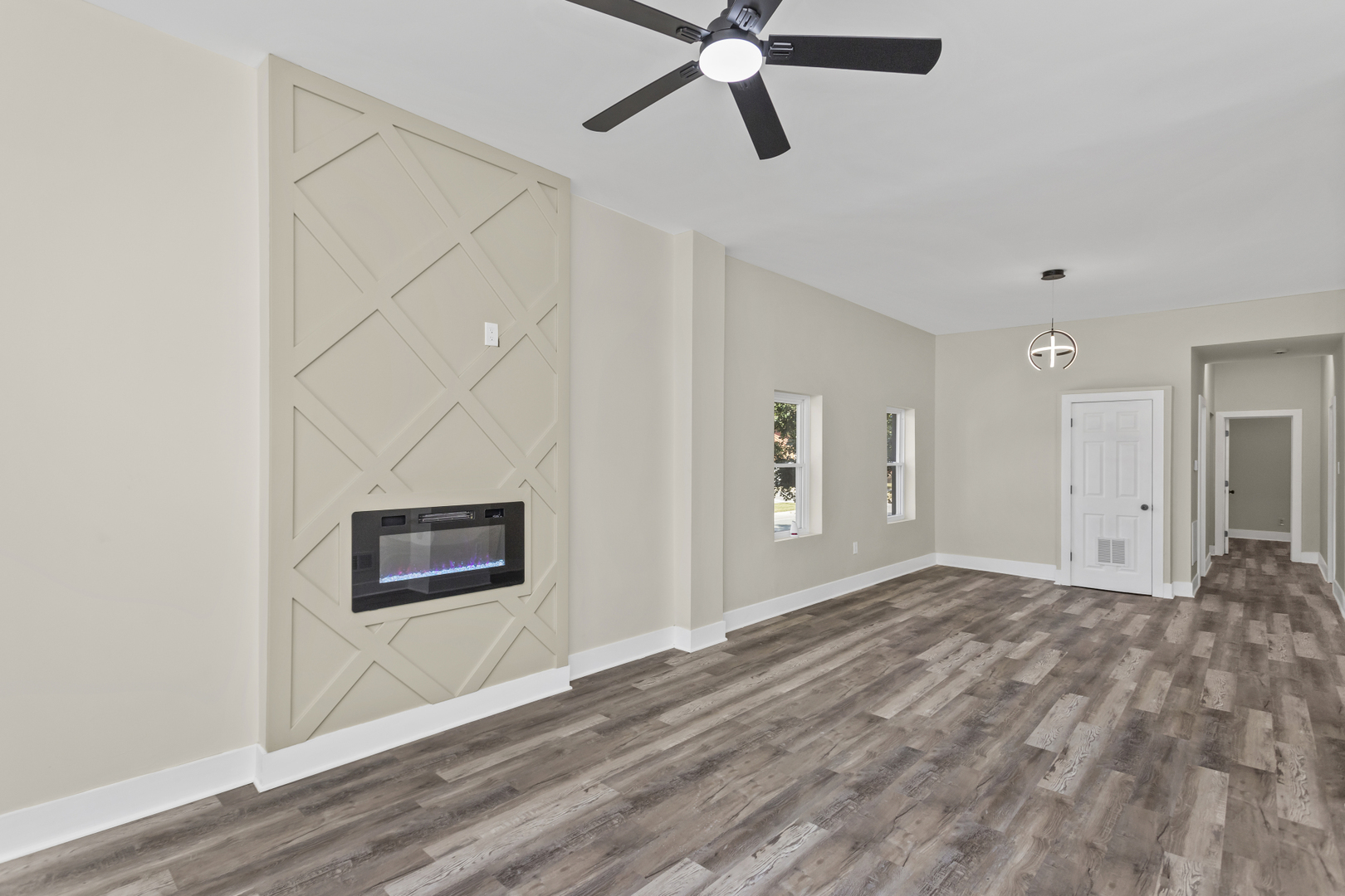 6601 South Rhodes Avenue Chicago, IL 60637 - Photo 13 of 22 a view of a room with a ceiling fan and wooden floor