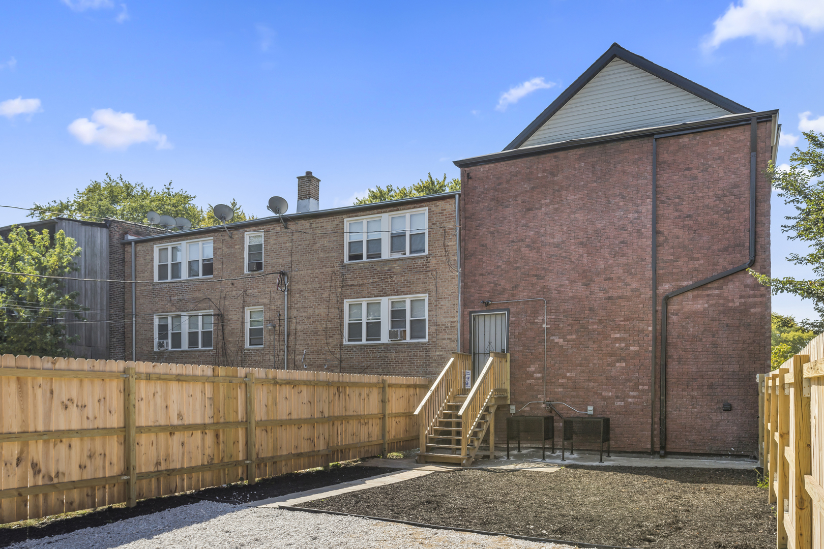6601 South Rhodes Avenue Chicago, IL 60637 - Photo 22 of 22 a front view of a house with a yard