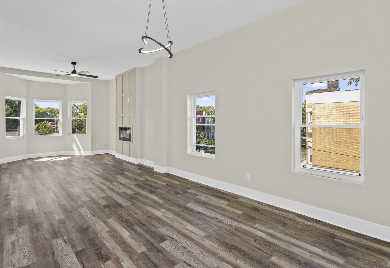 6601 South Rhodes Avenue Chicago, IL 60637 - Photo 5 of 22 a view of an empty room with wooden floor and a window