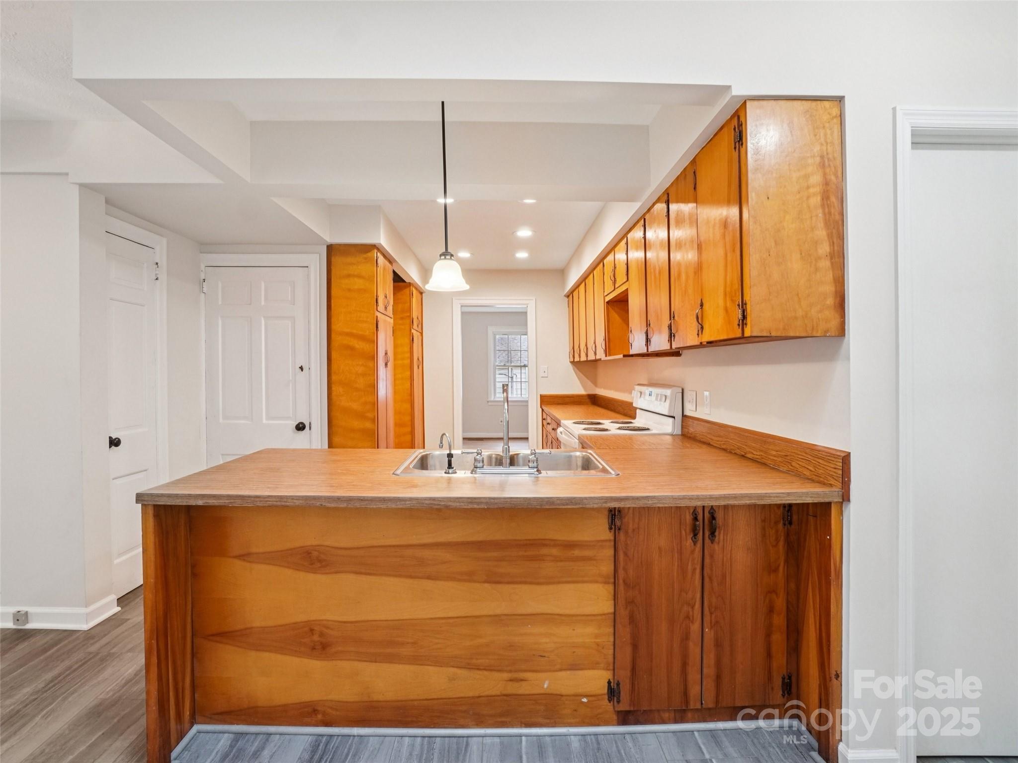 34 Parkview Drive Brevard, NC 28712 - Photo 11 of 38 a bathroom with a sink a vanity and a mirror