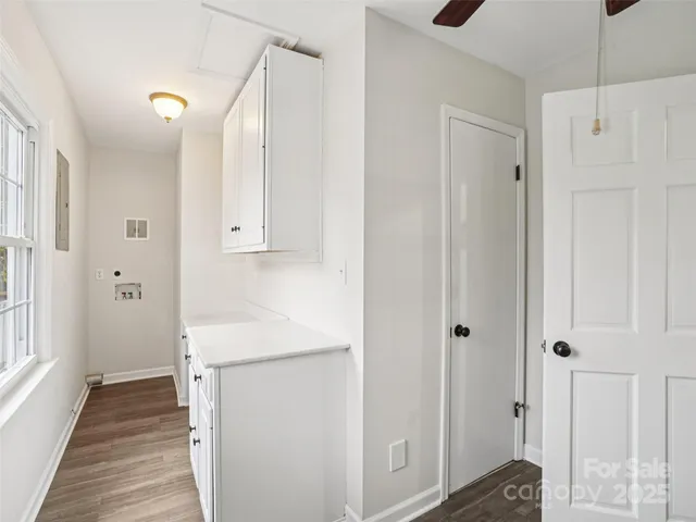 a view of hallway with wooden floor