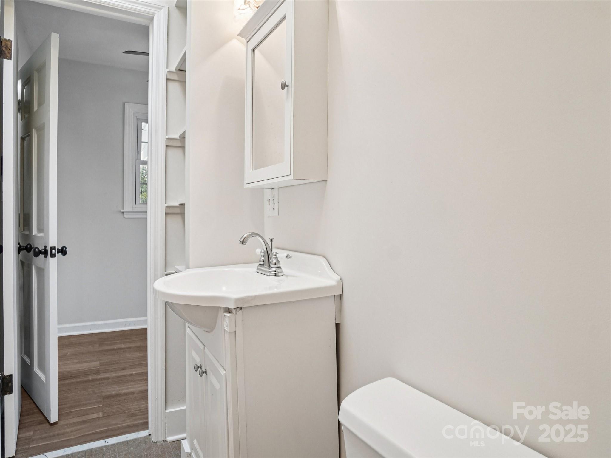 34 Parkview Drive Brevard, NC 28712 - Photo 13 of 38 a bathroom with a sink a toilet and shower