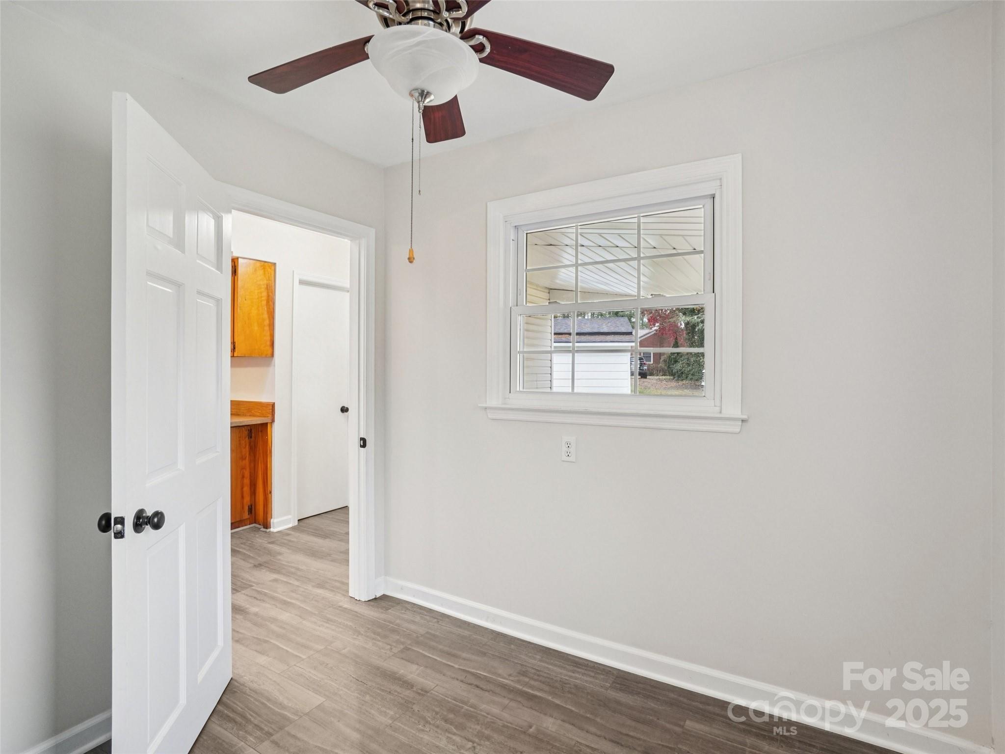 34 Parkview Drive Brevard, NC 28712 - Photo 14 of 38 wooden floor in an empty room with a window