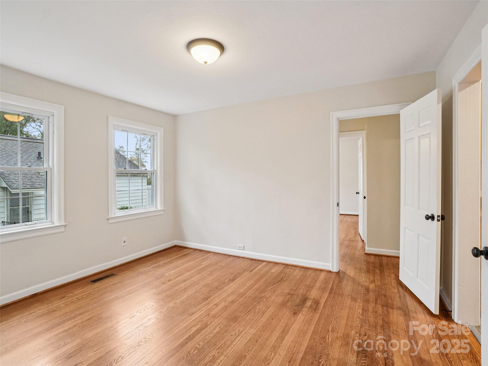 34 Parkview Drive Brevard, NC 28712 - Photo 16 of 38 a view of an empty room with wooden floor and a window