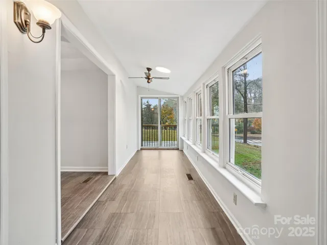 a view of an entryway with wooden floor