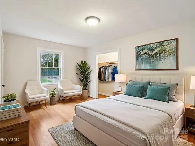 a bedroom with a large bed and a couch