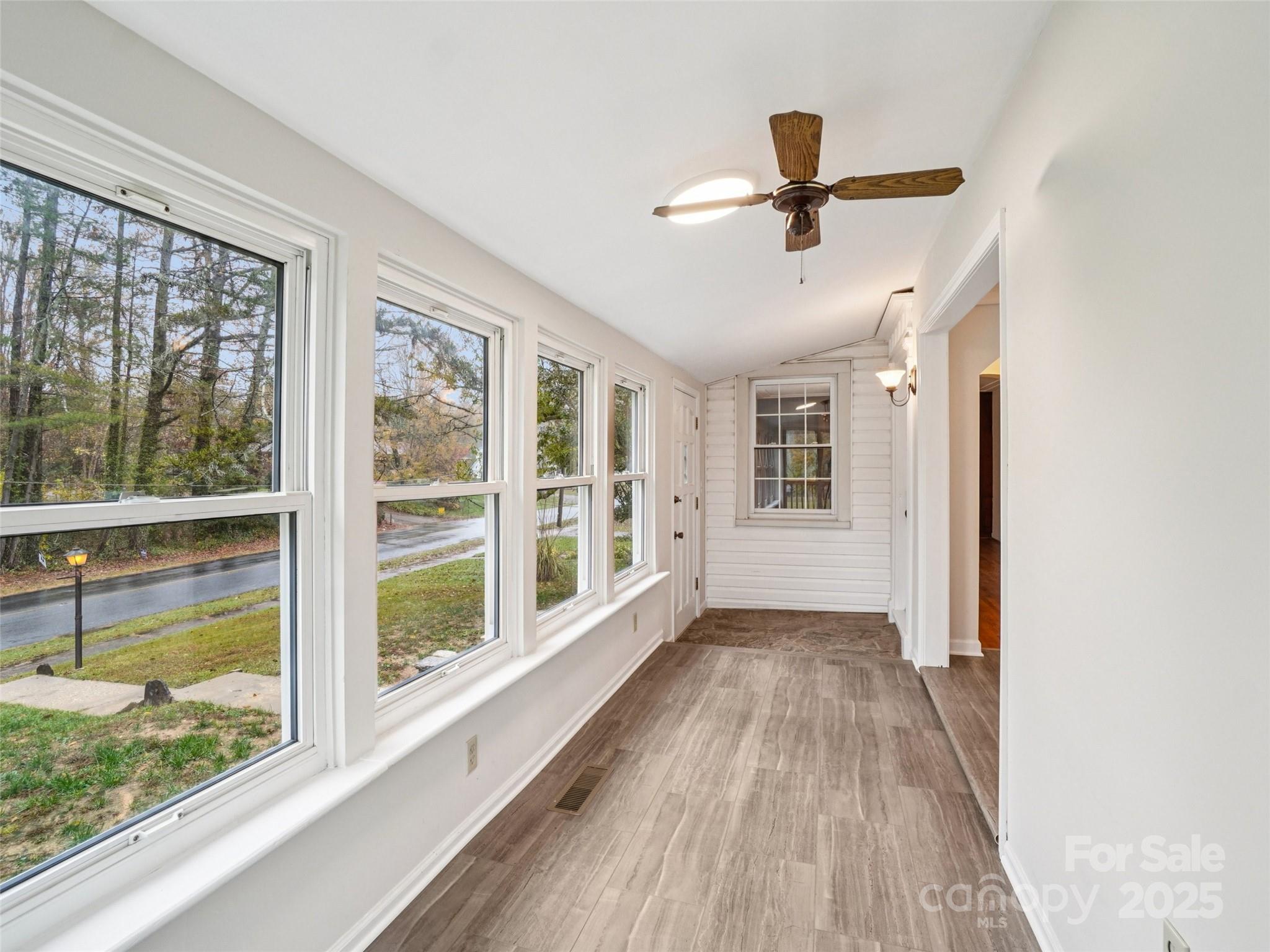 34 Parkview Drive Brevard, NC 28712 - Photo 3 of 38 a view of empty room with wooden floor and fan