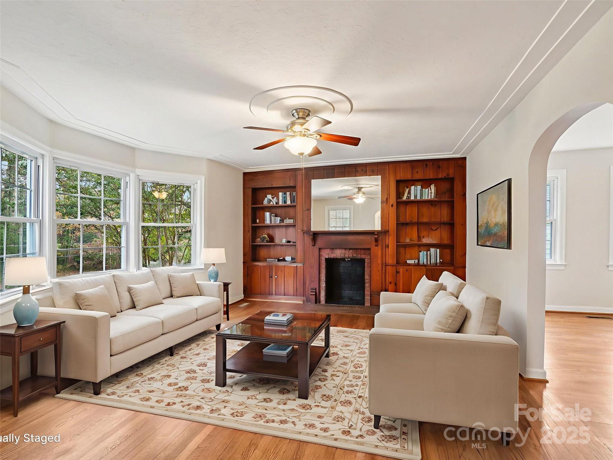 34 Parkview Drive Brevard, NC 28712 - Photo 5 of 38 a living room with furniture a fireplace and a floor to ceiling window