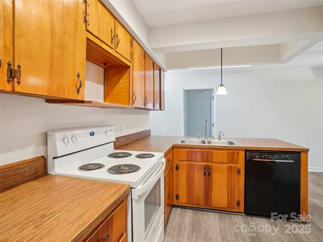 a kitchen with a stove and a microwave