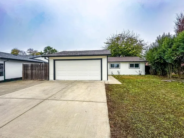 a house view with a backyard space