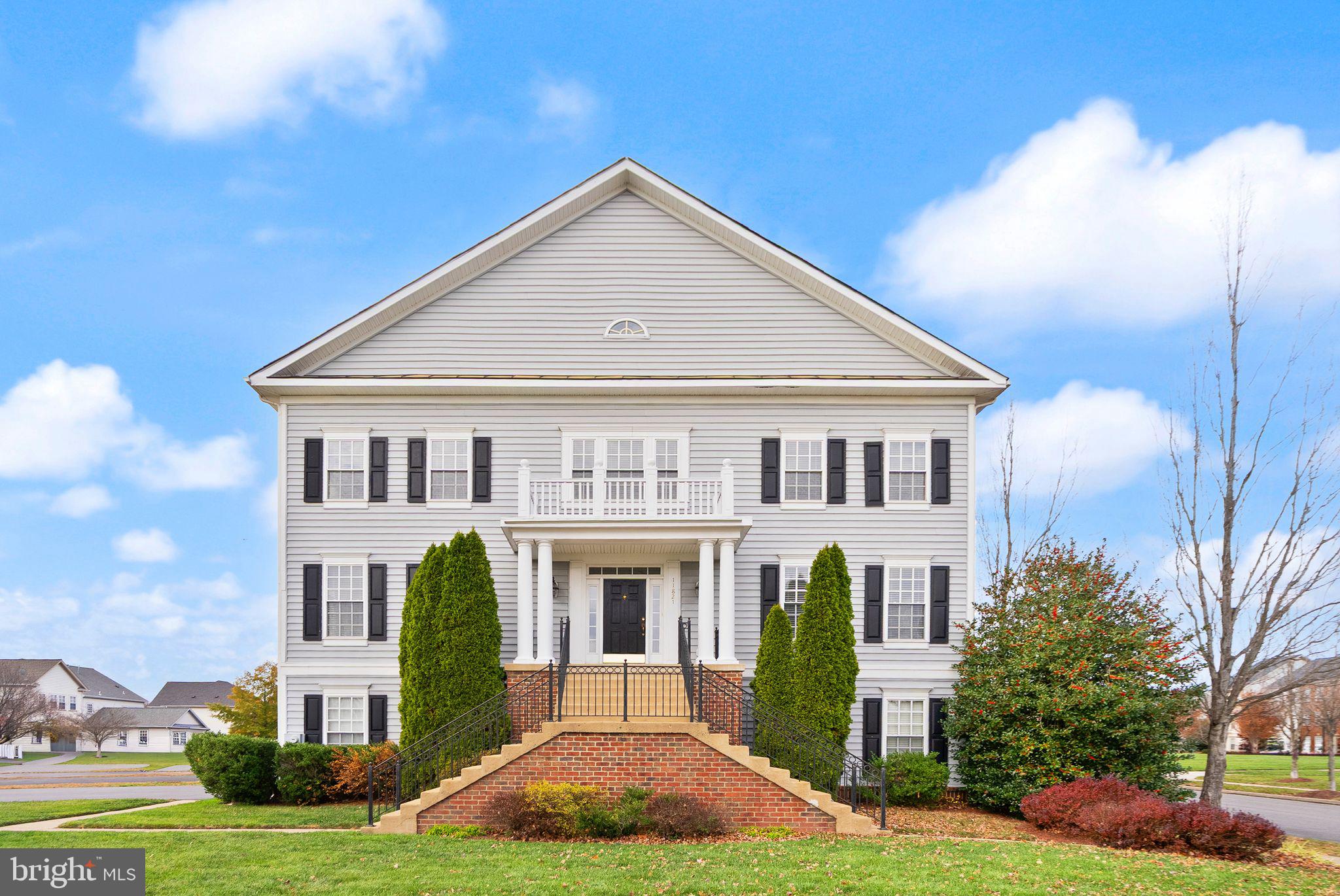 11821 Whitworth Cannon Lane Bristow, VA 20136 - Photo 1 of 70 a front view of a house with garden