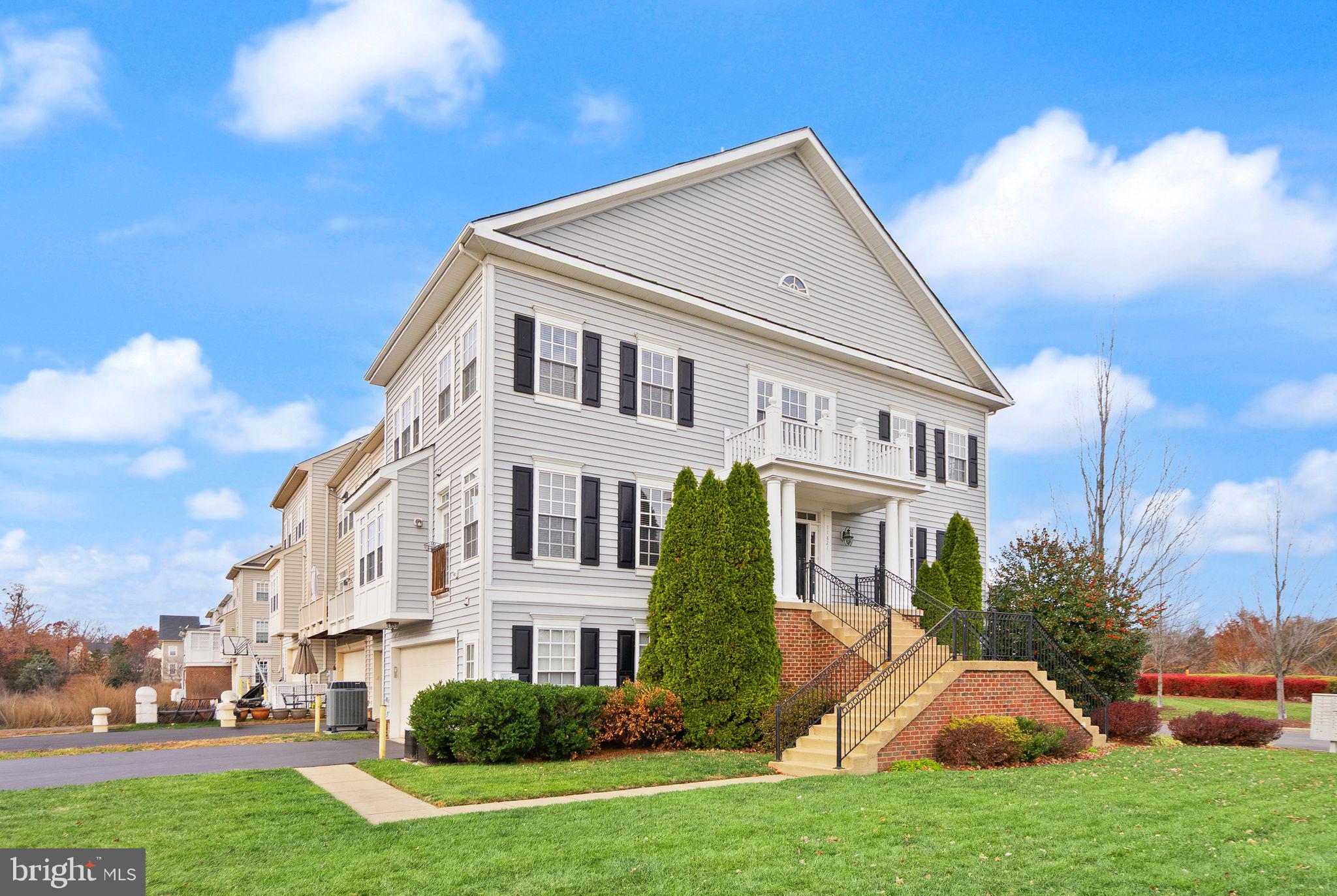 11821 Whitworth Cannon Lane Bristow, VA 20136 - Photo 2 of 70 a view of a big yard with plants and a fountain