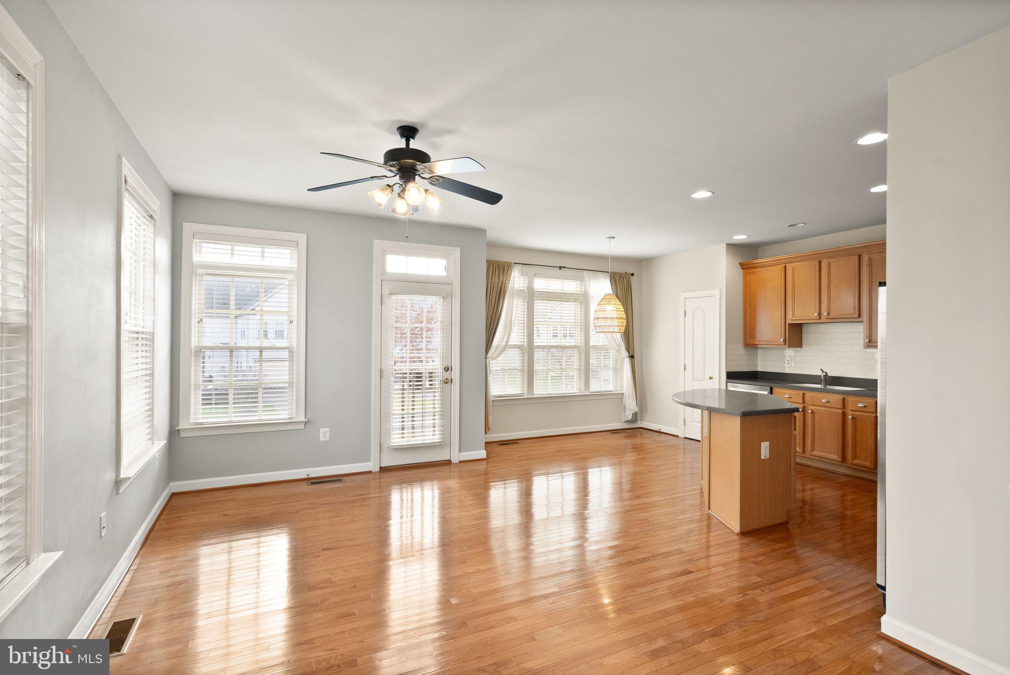 11821 Whitworth Cannon Lane Bristow, VA 20136 - Photo 23 of 70 a view of an empty room with window and wooden floor