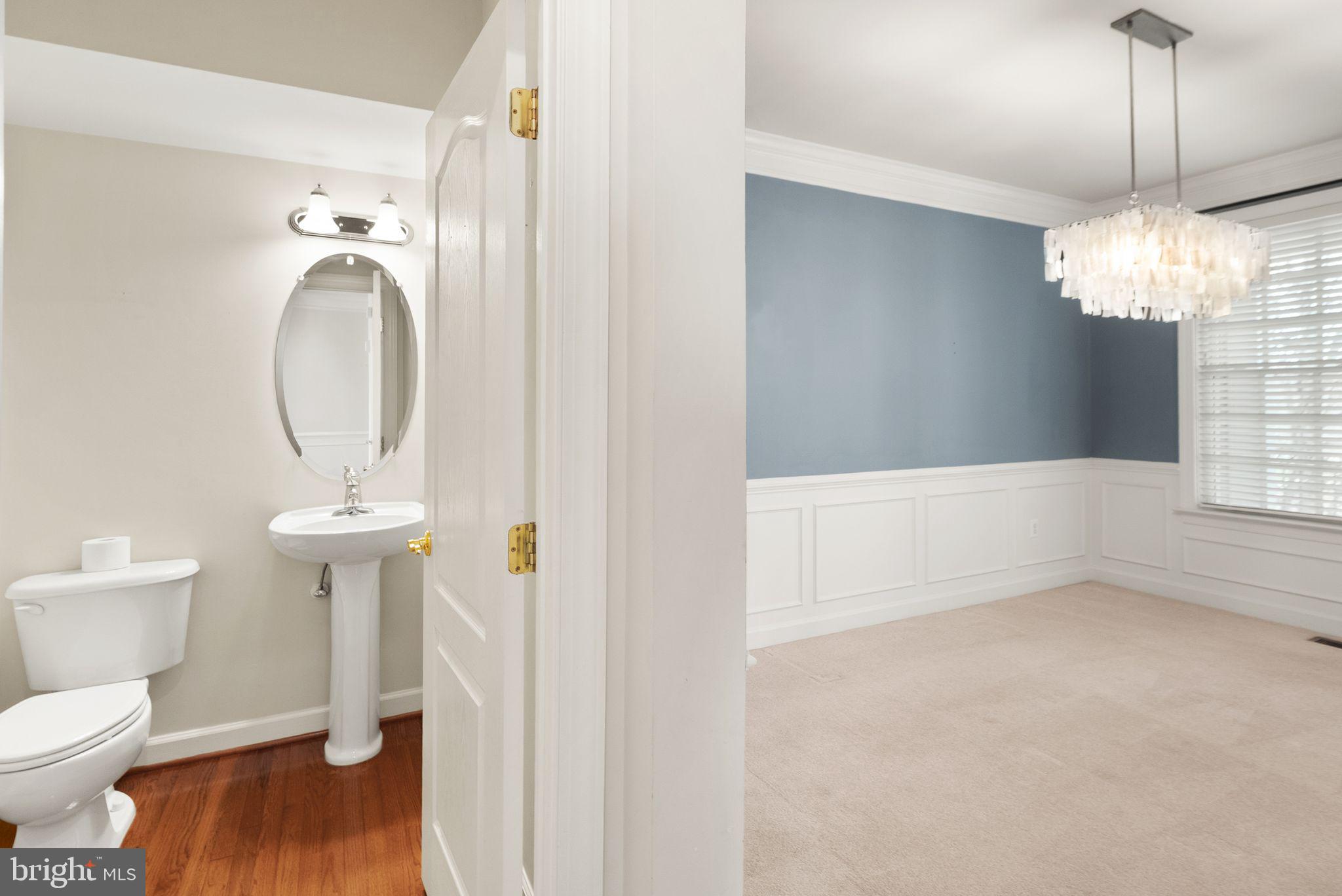 11821 Whitworth Cannon Lane Bristow, VA 20136 - Photo 32 of 70 a bathroom with a toilet sink and a mirror