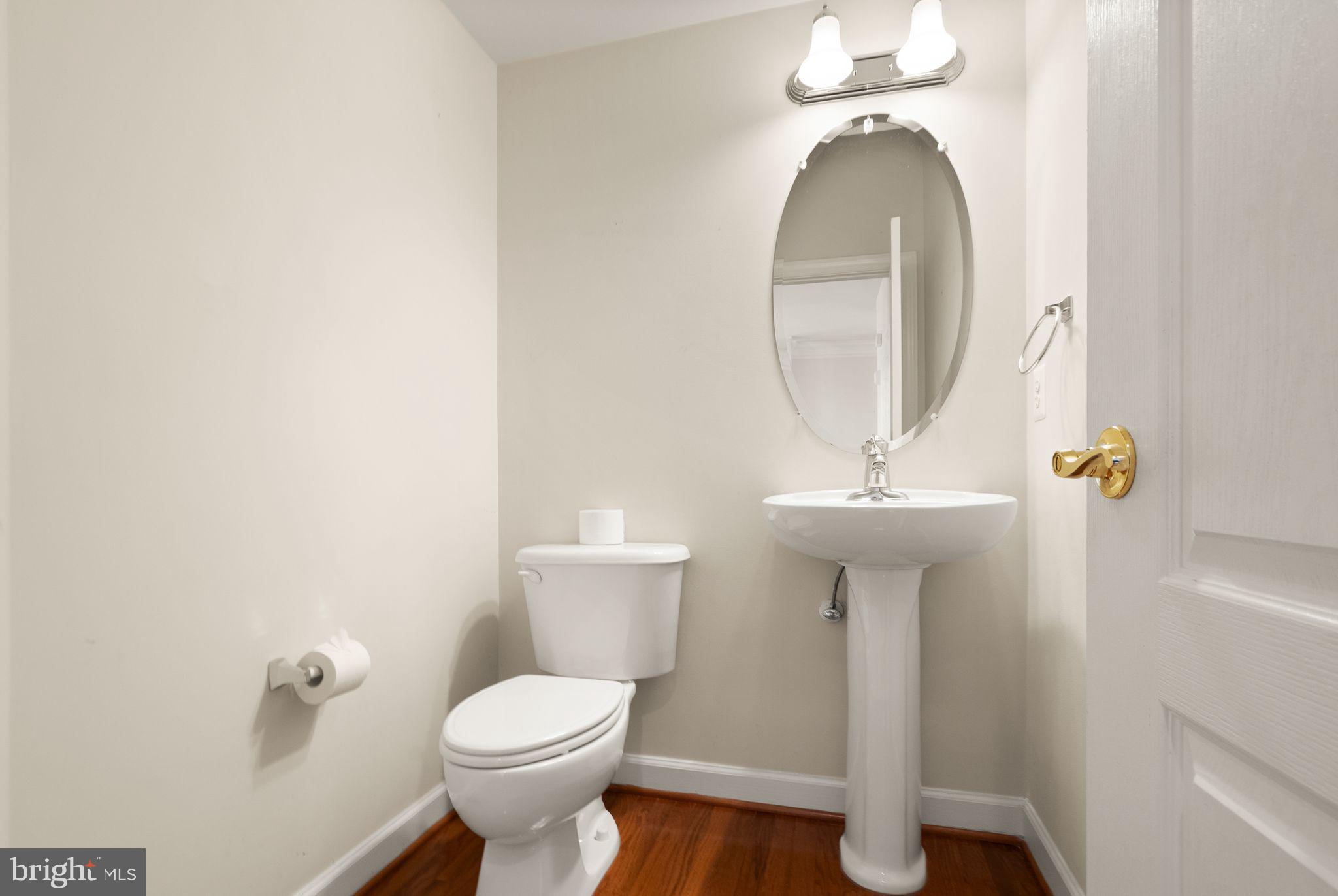 11821 Whitworth Cannon Lane Bristow, VA 20136 - Photo 33 of 70 a bathroom with a toilet sink and mirror