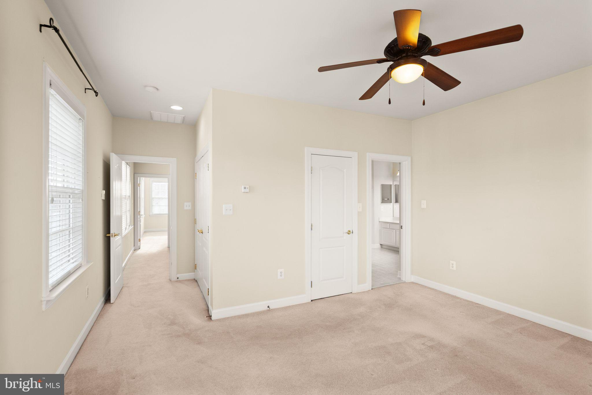 11821 Whitworth Cannon Lane Bristow, VA 20136 - Photo 39 of 70 a view of a livingroom with a ceiling fan and window
