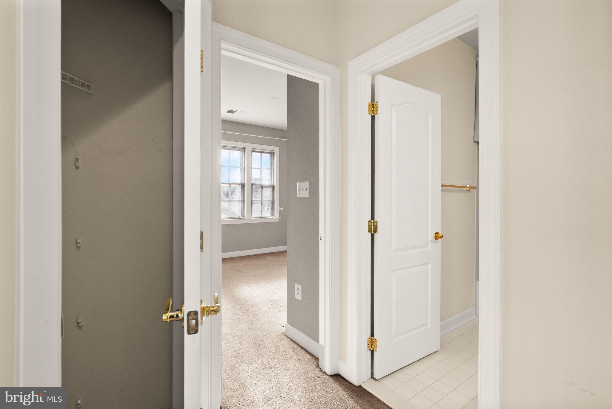 11821 Whitworth Cannon Lane Bristow, VA 20136 - Photo 50 of 70 a view of a bathroom from a hallway