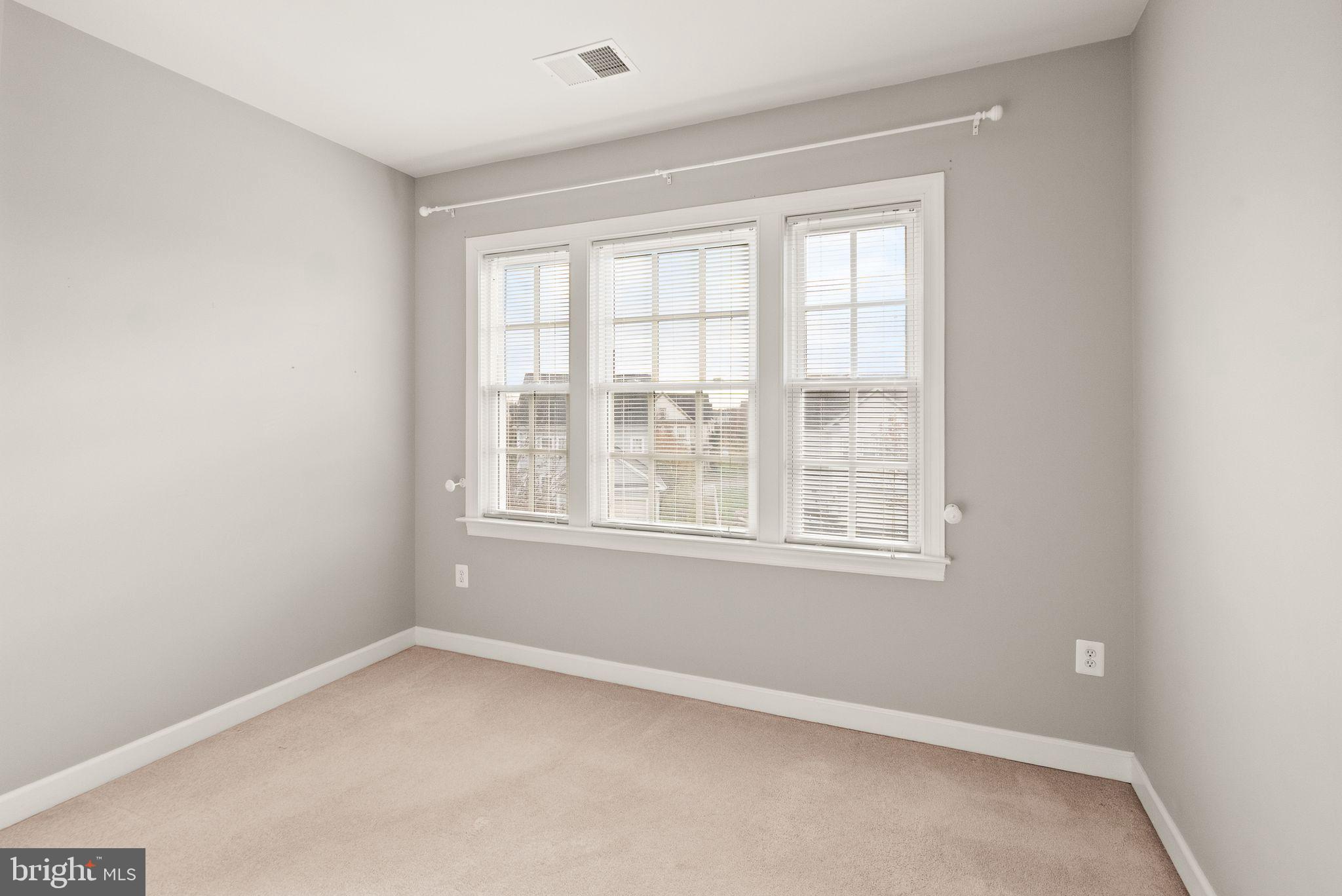 11821 Whitworth Cannon Lane Bristow, VA 20136 - Photo 52 of 70 an empty room with a window